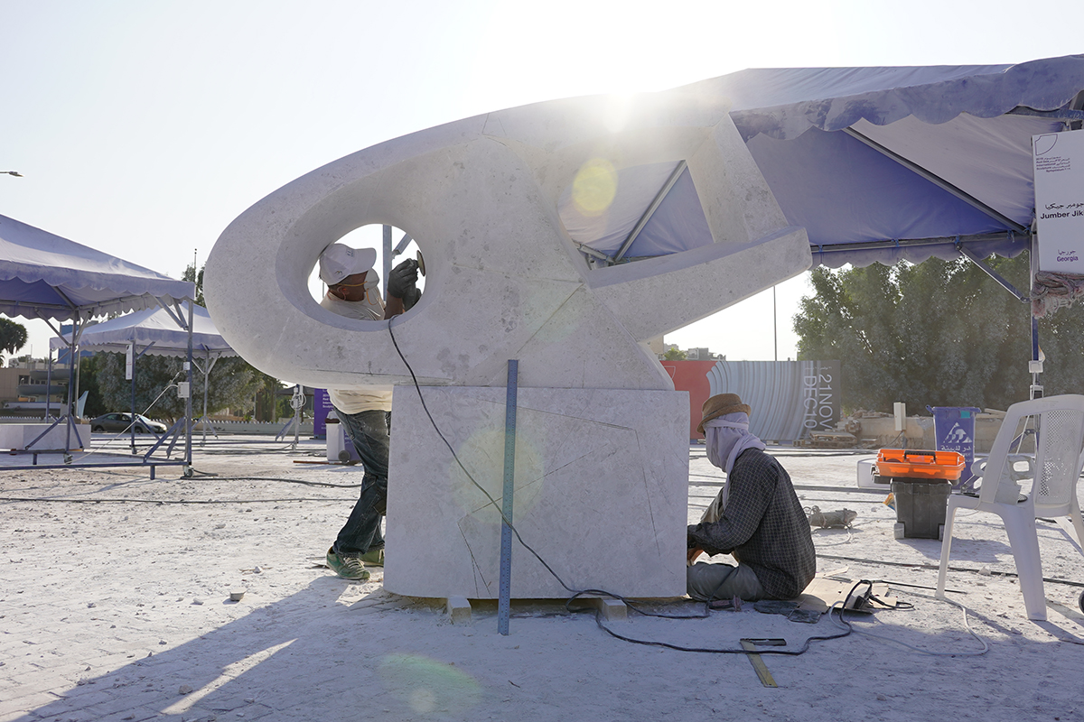 Artists sculpting marble sculpture