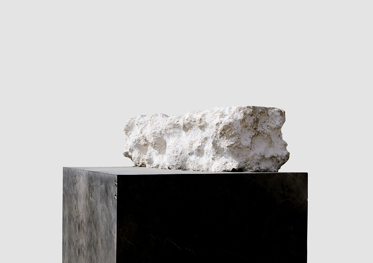 Marble sculpture on black plinth