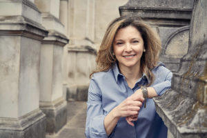 Woman leaning against wall