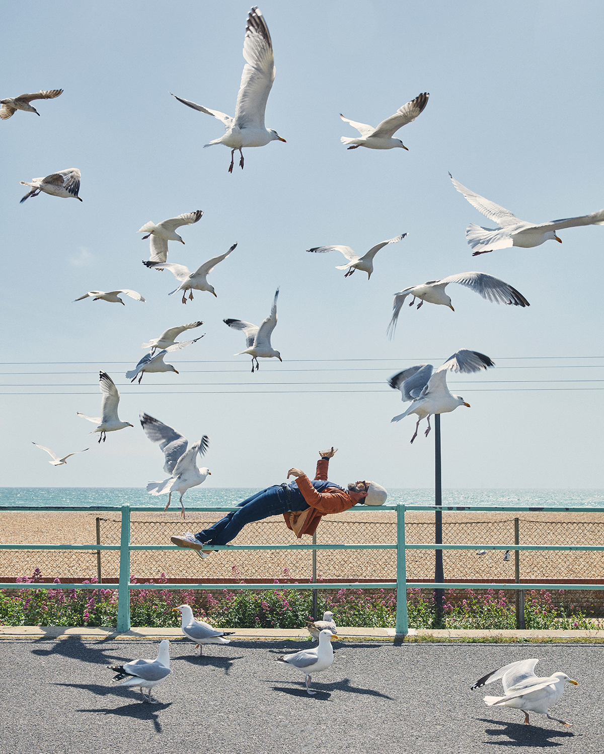 Man floating with seagulls