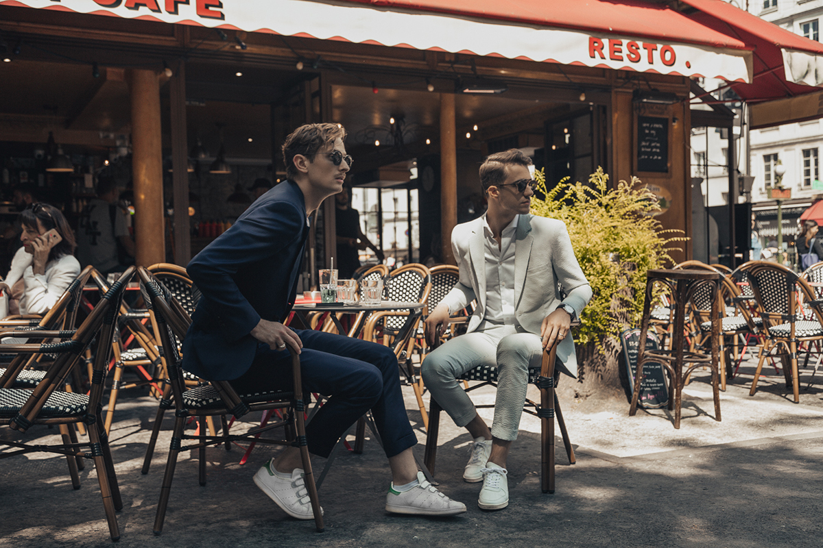 men outside a cafe