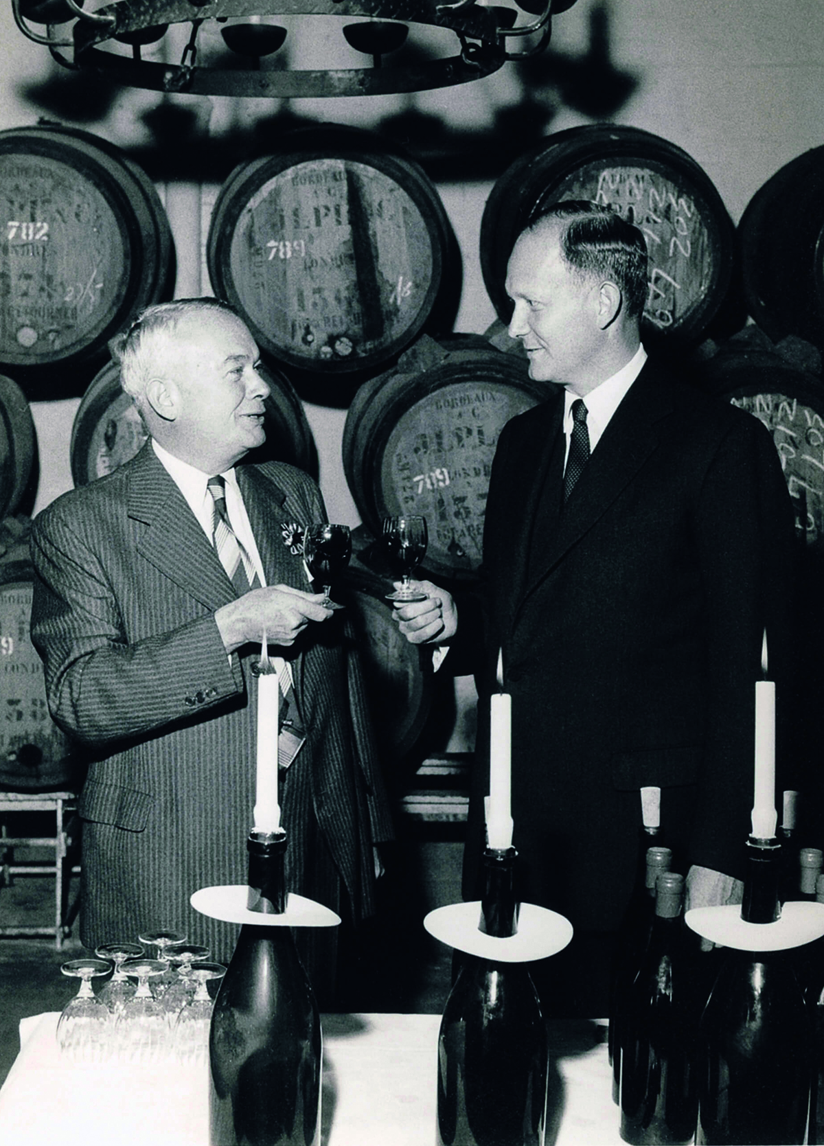 Vintage photograph men in wine cellar