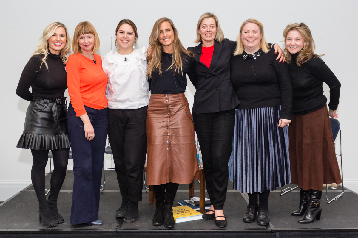 women standing on stage