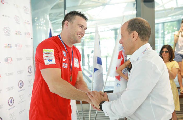 Man awarding medal