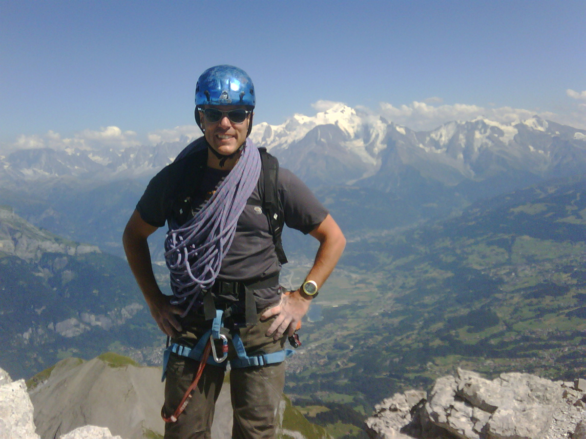 man on mountain summit