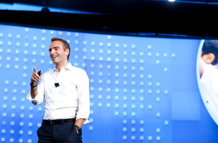 man giving speech on a stage