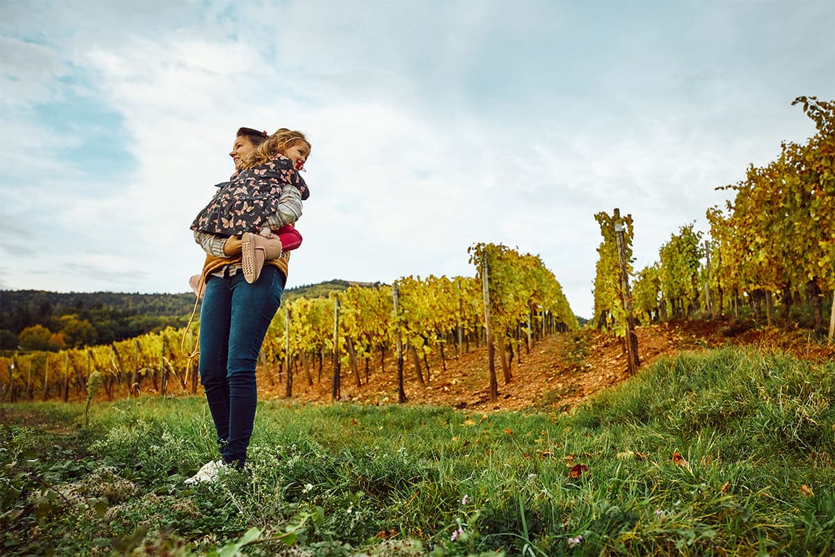 mother and daughter in vineyard