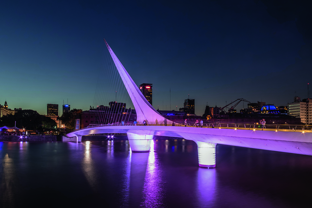 a bridge lit by pink neon