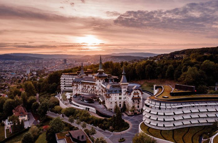 mountaintop hotel overlooking a city