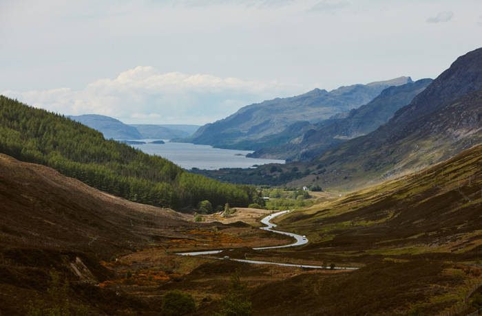 mountainous landscape with lake in distance