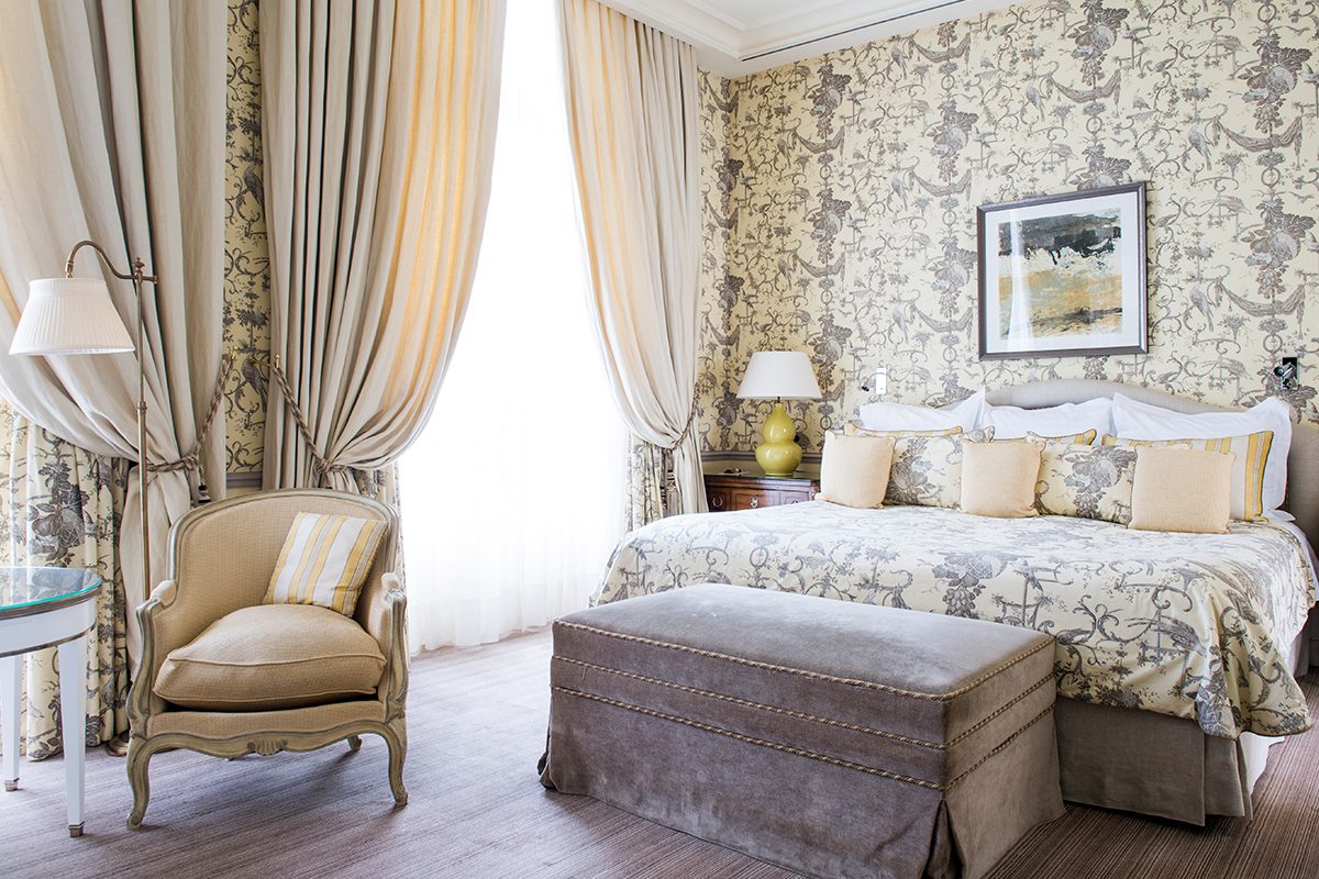 hotel bedroom with plush furnishings