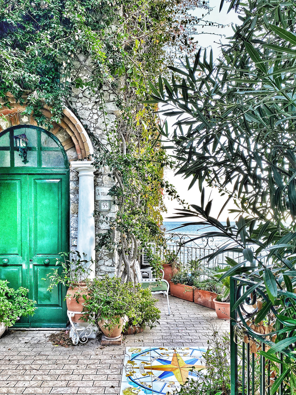 house with green door by the sea