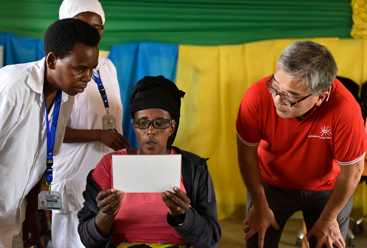 people trying glasses in Rwanda
