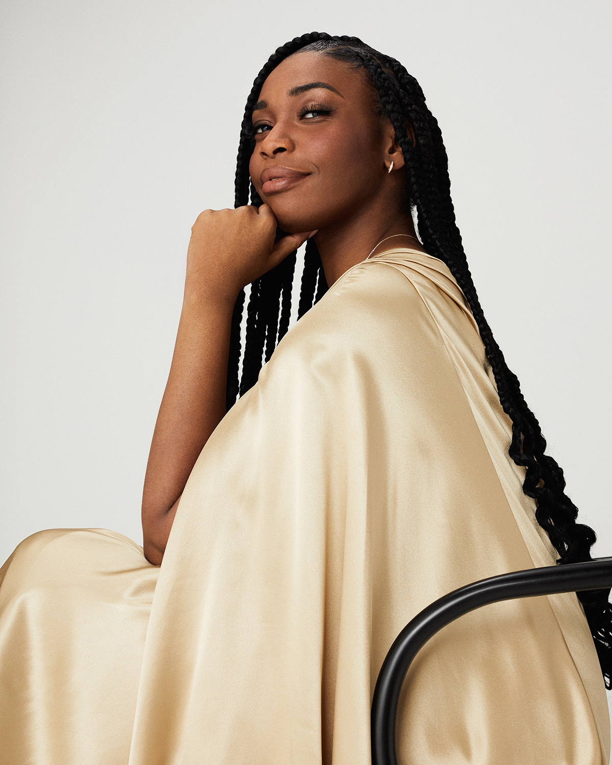 portrait of a black woman in a cream robe