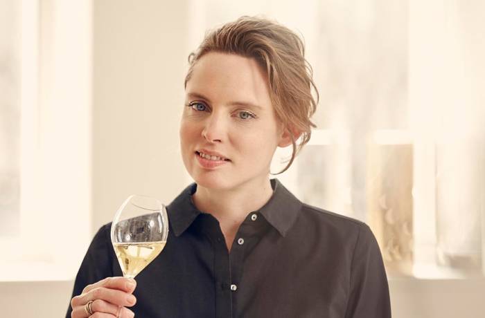 woman holding glass of champagne