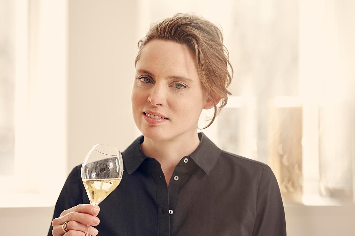 woman holding glass of champagne