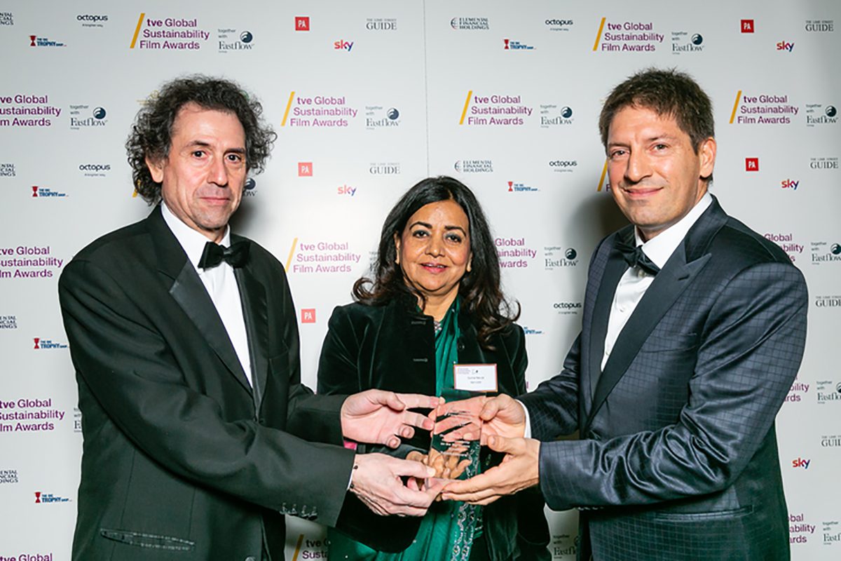 Surina Narula holding an award