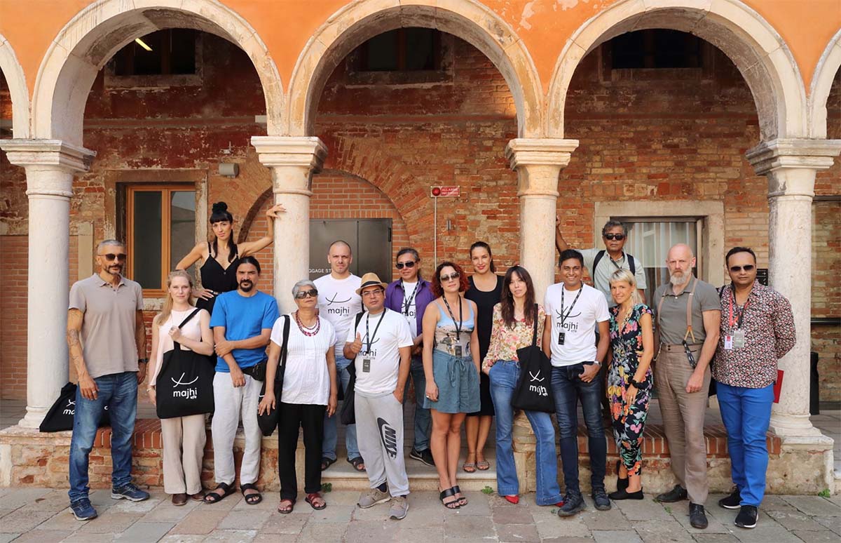 group of people standing underneath arch