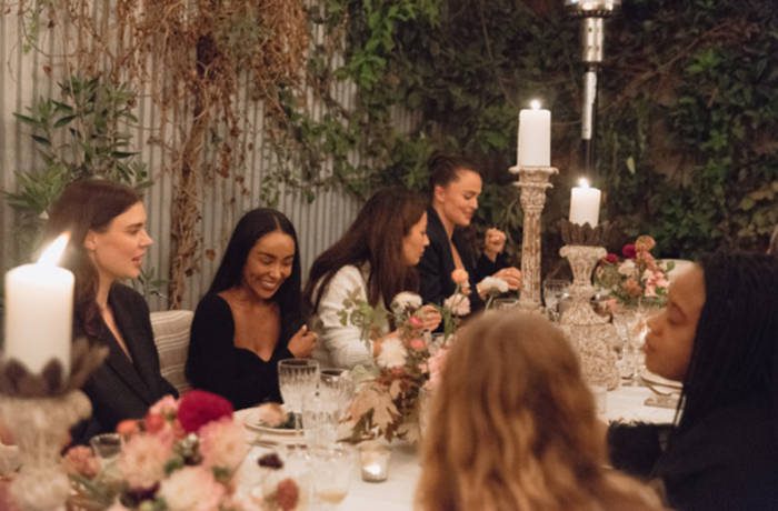 people gathered round dining table