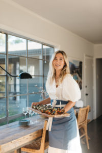 woman holding plate of food