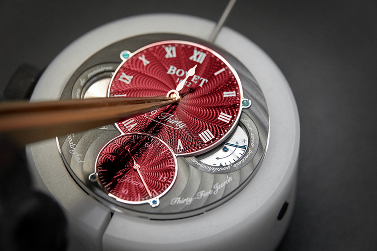 a red watch dial being made 