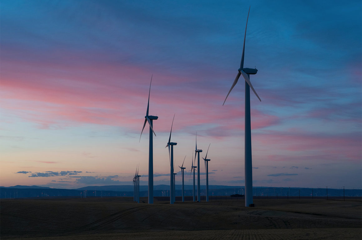 Wind farm and a pink and blue sunset