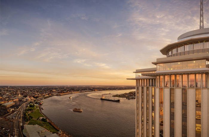 a building overlooking a city and lake