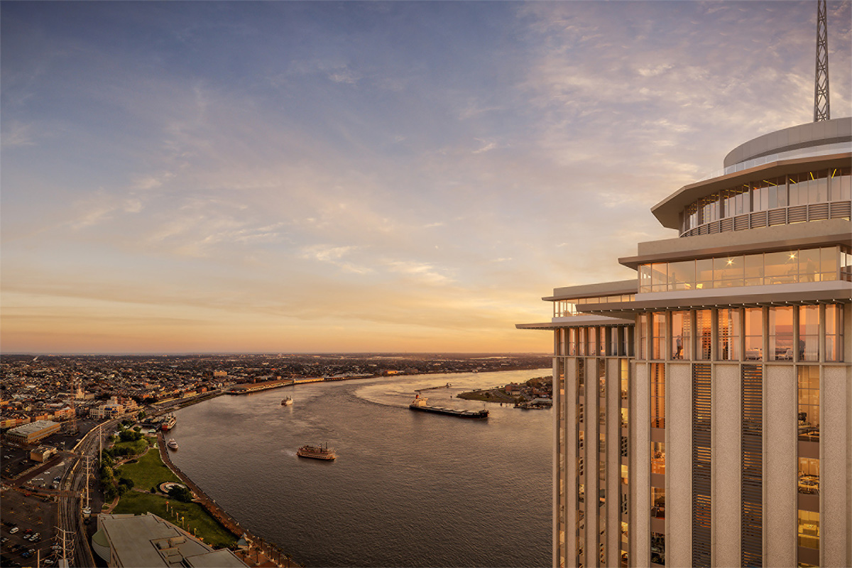 a building overlooking a city and lake