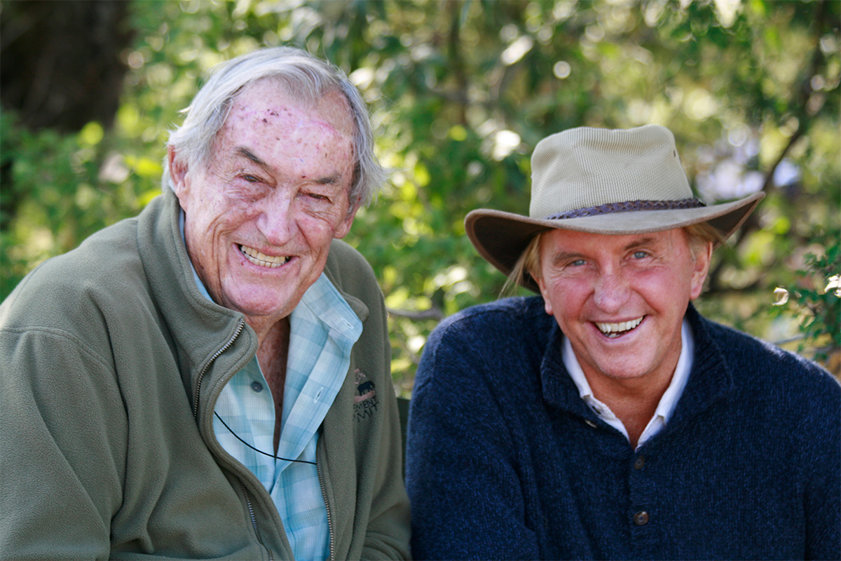 two men sitting side by side