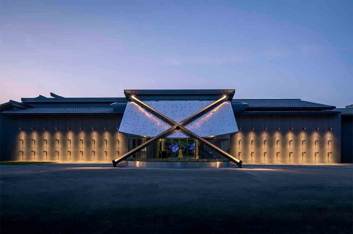 X Museum Exterior with lights shining against the building
