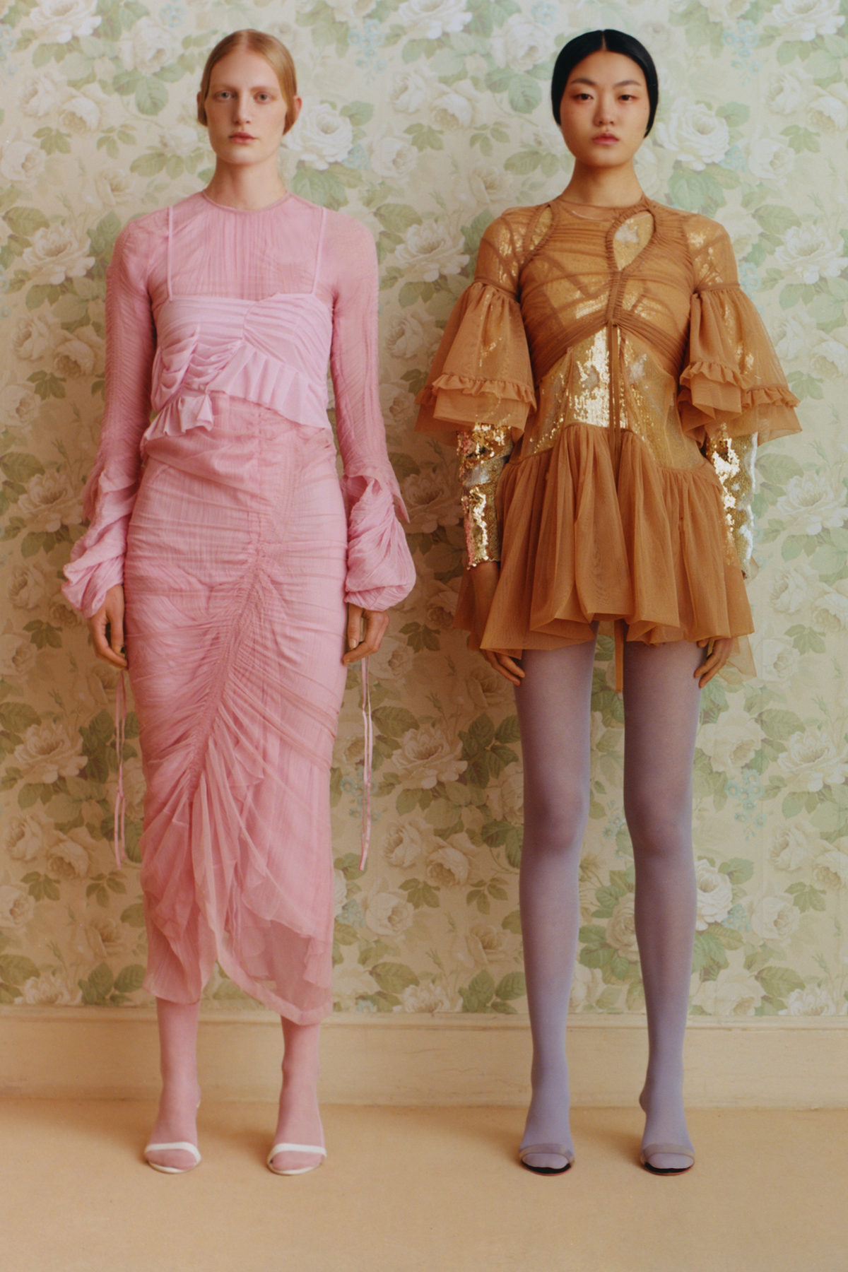 Two models wearing dresses