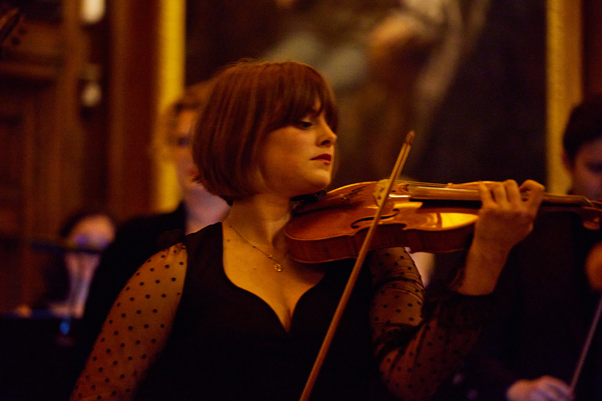 A woman playing the violin