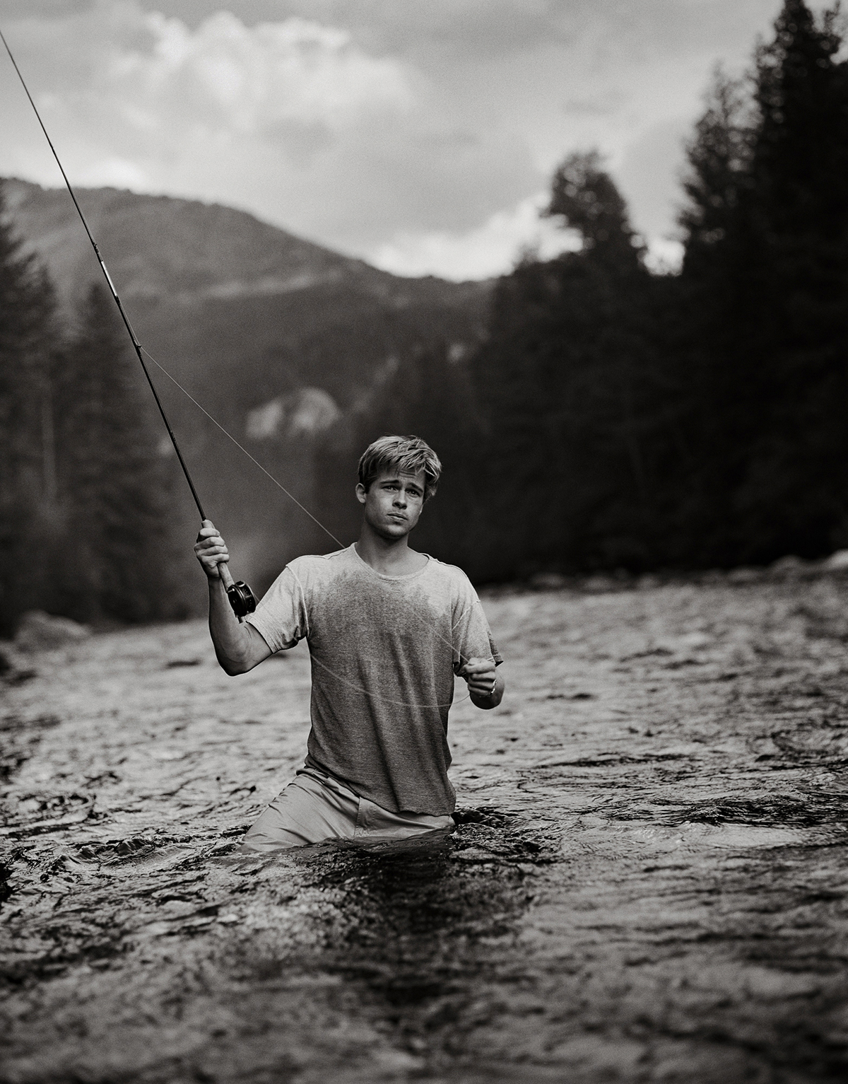 Brad Pitt fishing in a river