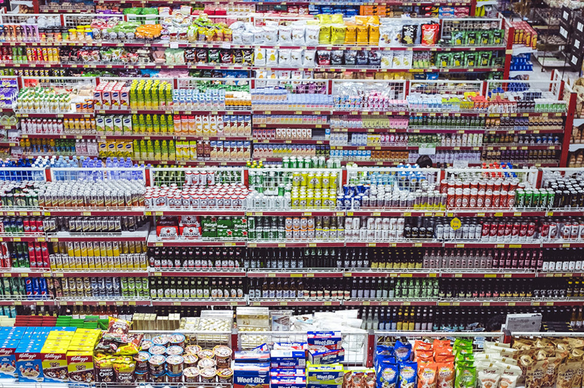consumer goods stacked on shelves in a supermarket