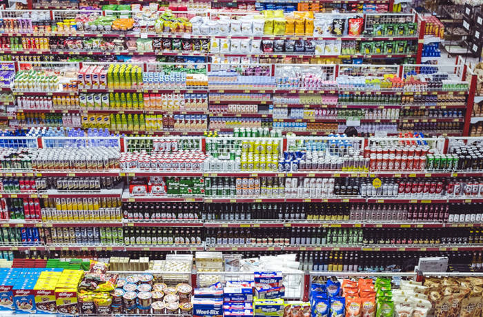 consumer goods stacked on shelves in a supermarket
