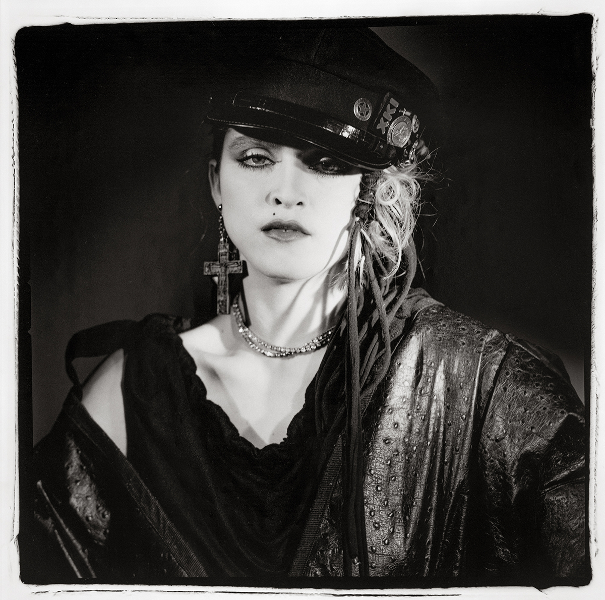 Madonna in a black dress and hat