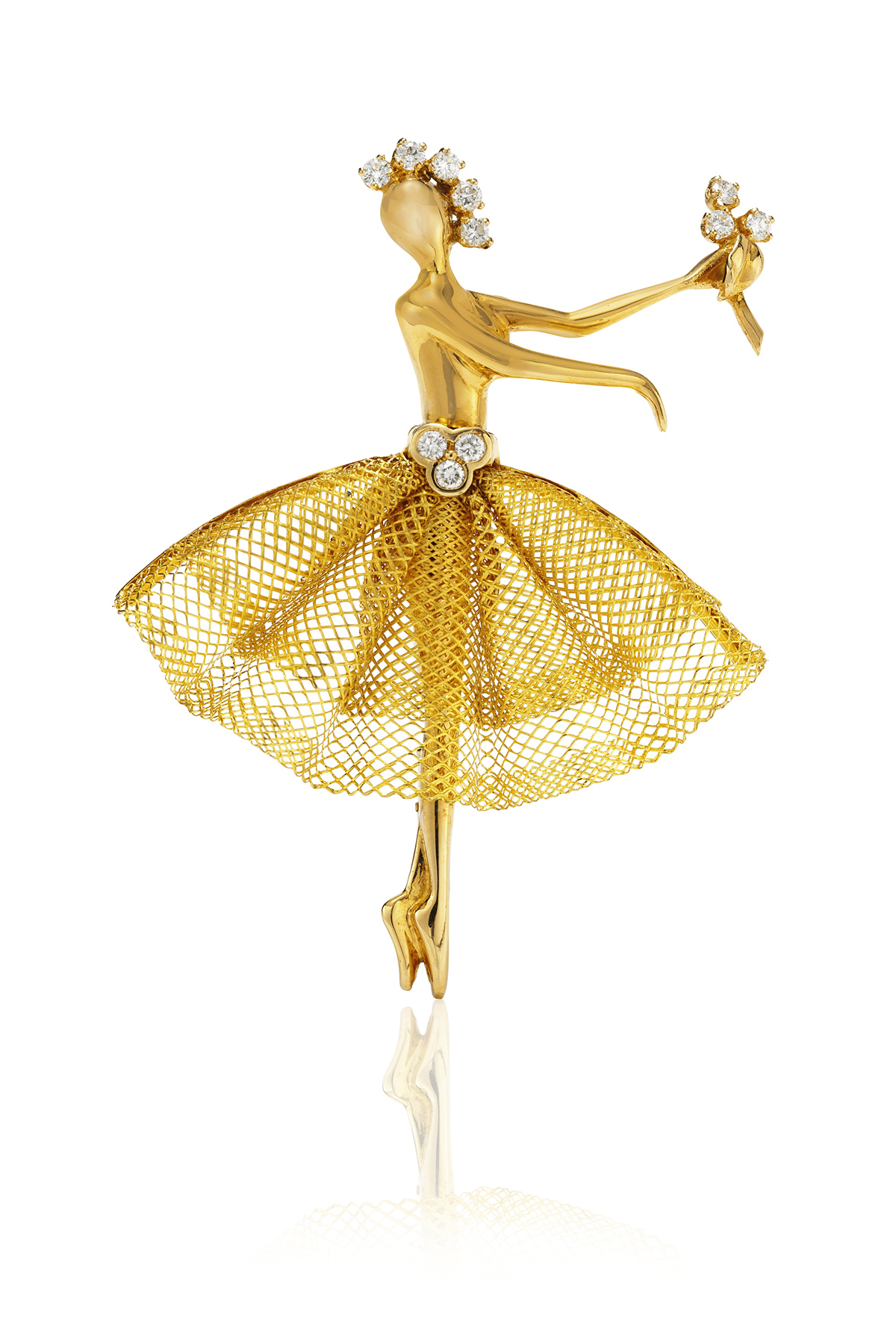 a ballerina clip in gold with diamonds