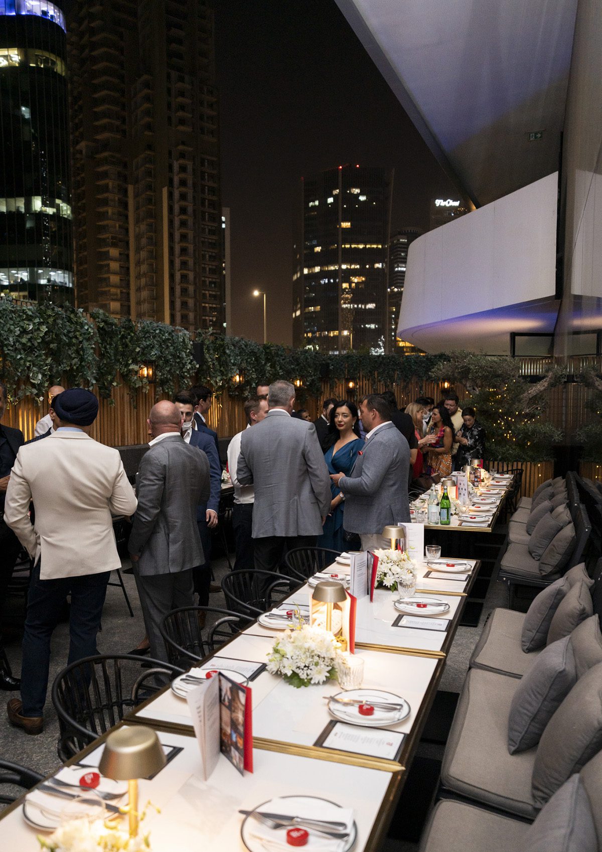 men standing in suits on a terrace