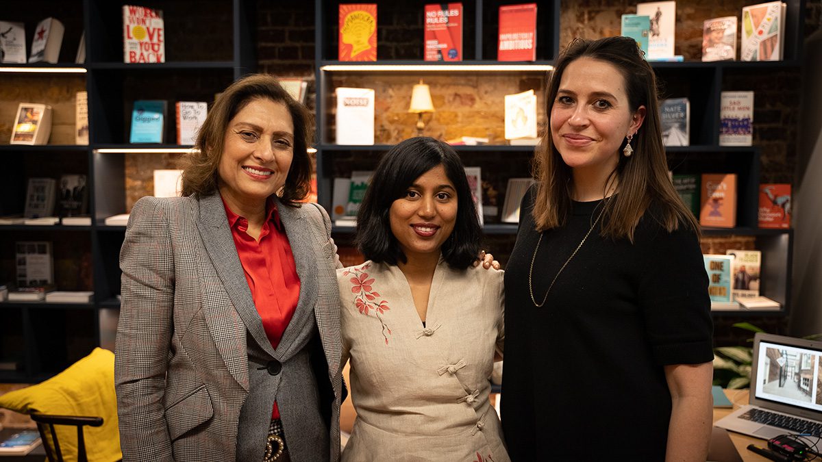 three women standing next to each other 