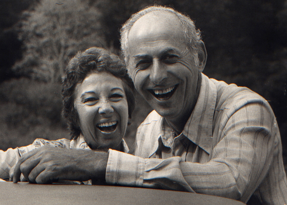 A black and white photo of a man and woman