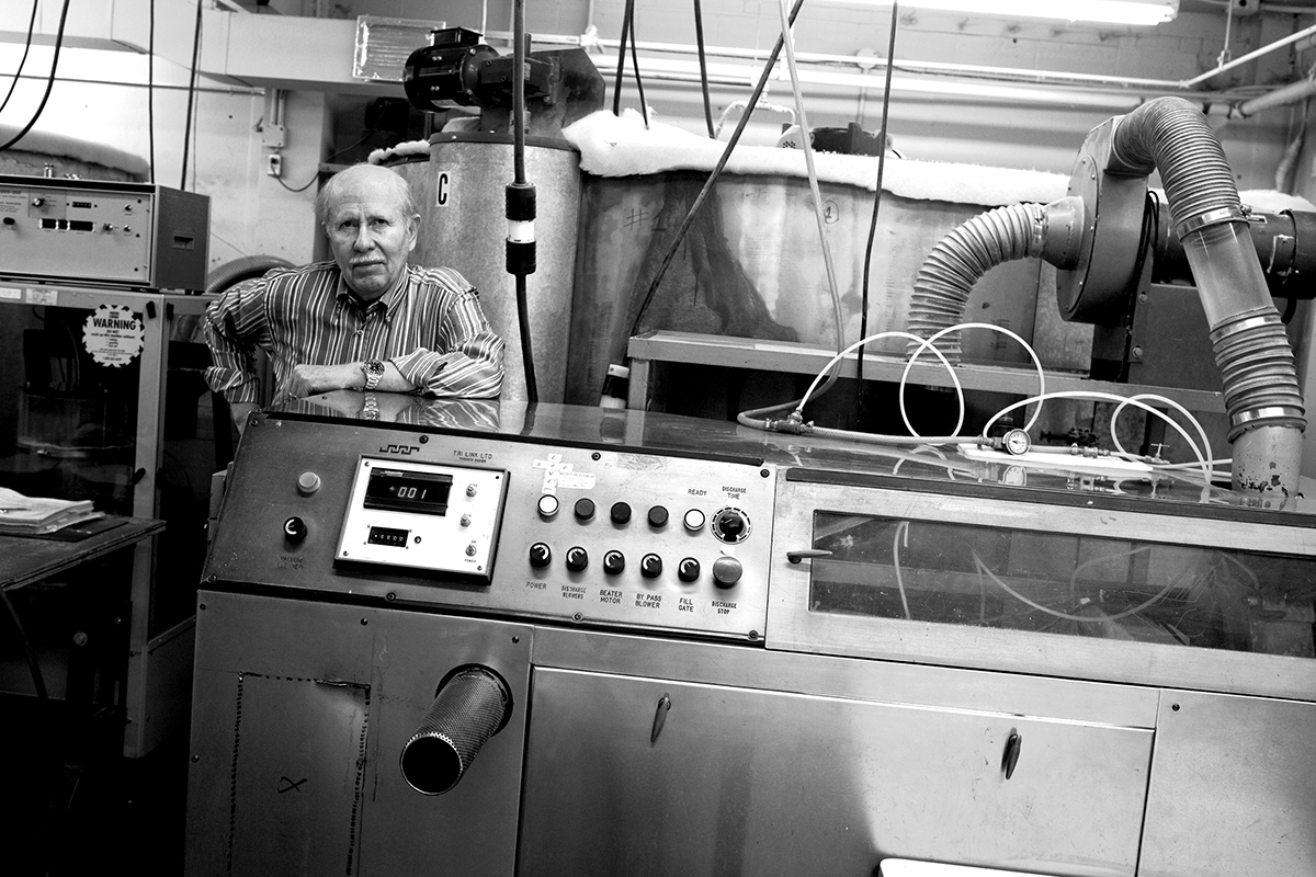 An old image of a man working in a factory