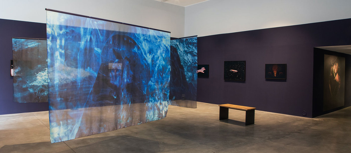 A hologram in blue in an art gallery