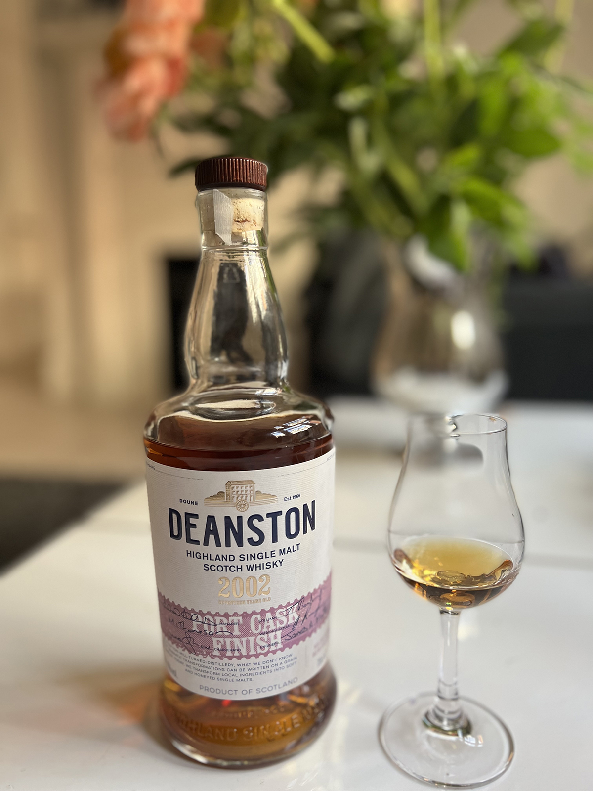 Deanston whiskey bottle with a glass of whiskey