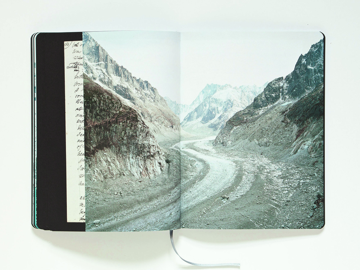 a book with pictures of mountains inside it