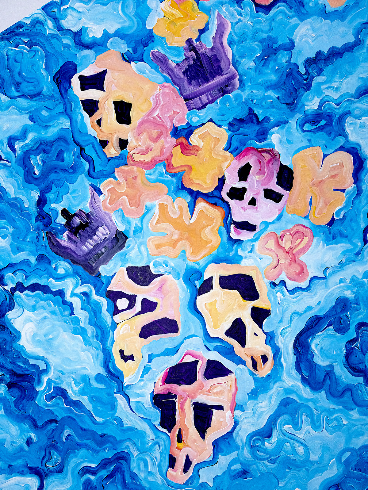 multicoloured skulls on a blue background
