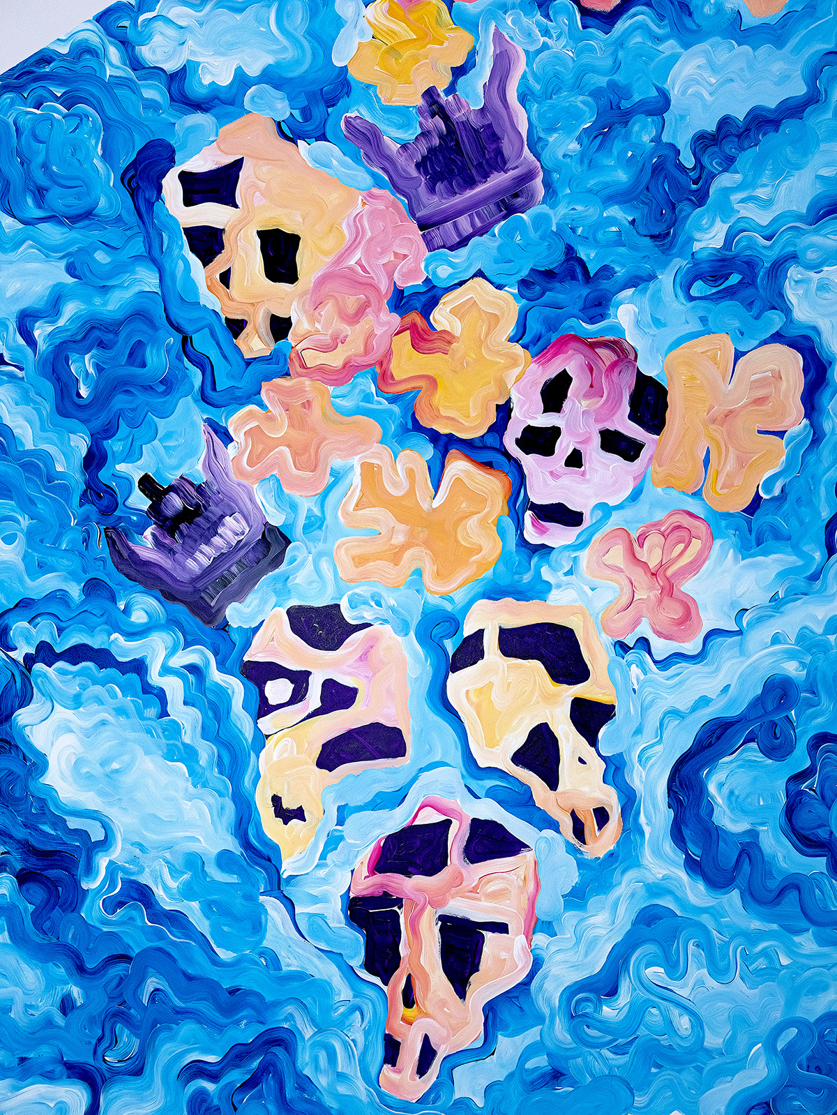 multicoloured skulls on a blue background