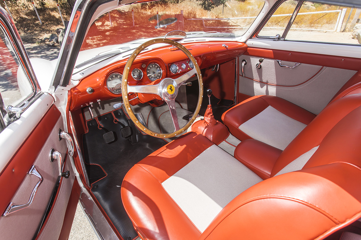 red and white leather interior of an old classic Ferrari