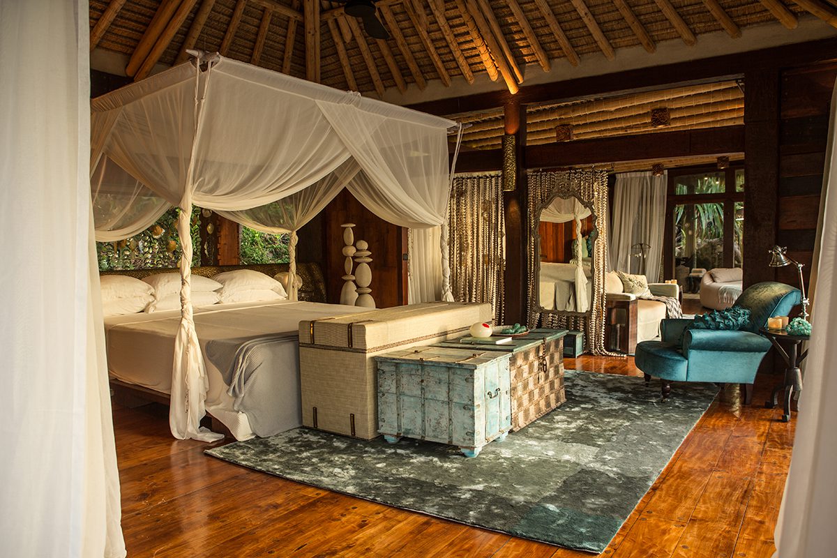 a wooden bed room with white and blue colourings