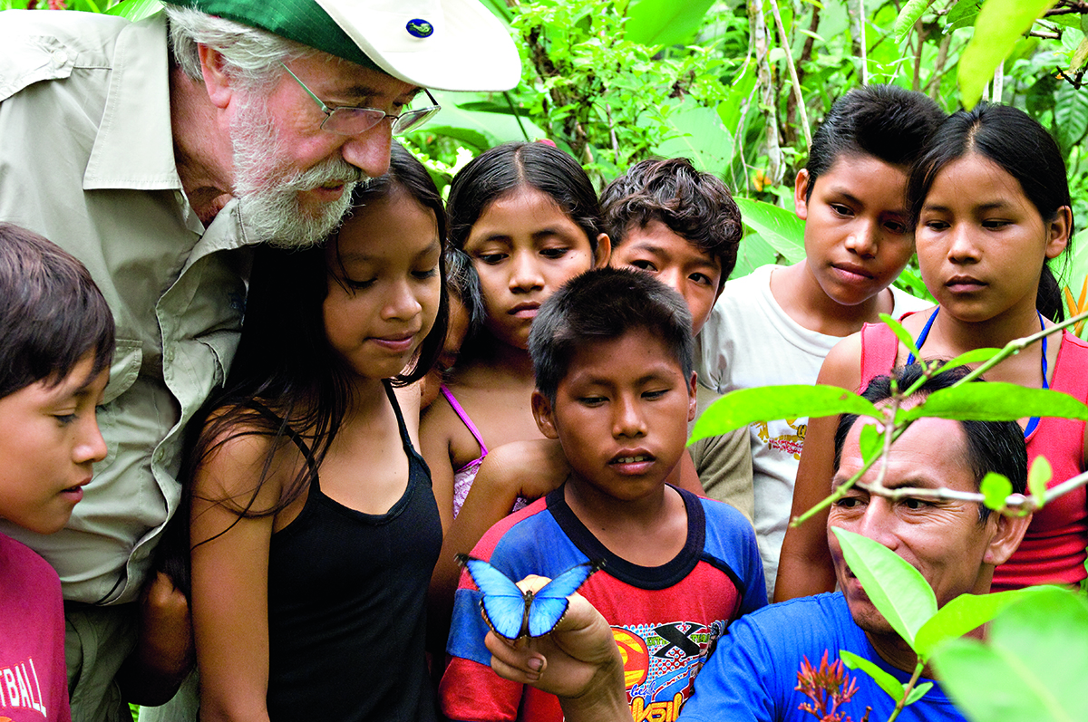 man with children in jungle 