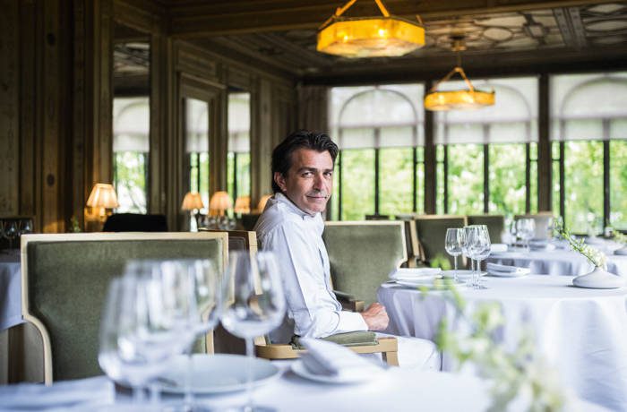 a chef sitting at a table